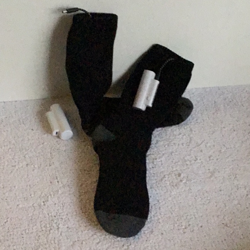 Heated socks with recharging battery pack.